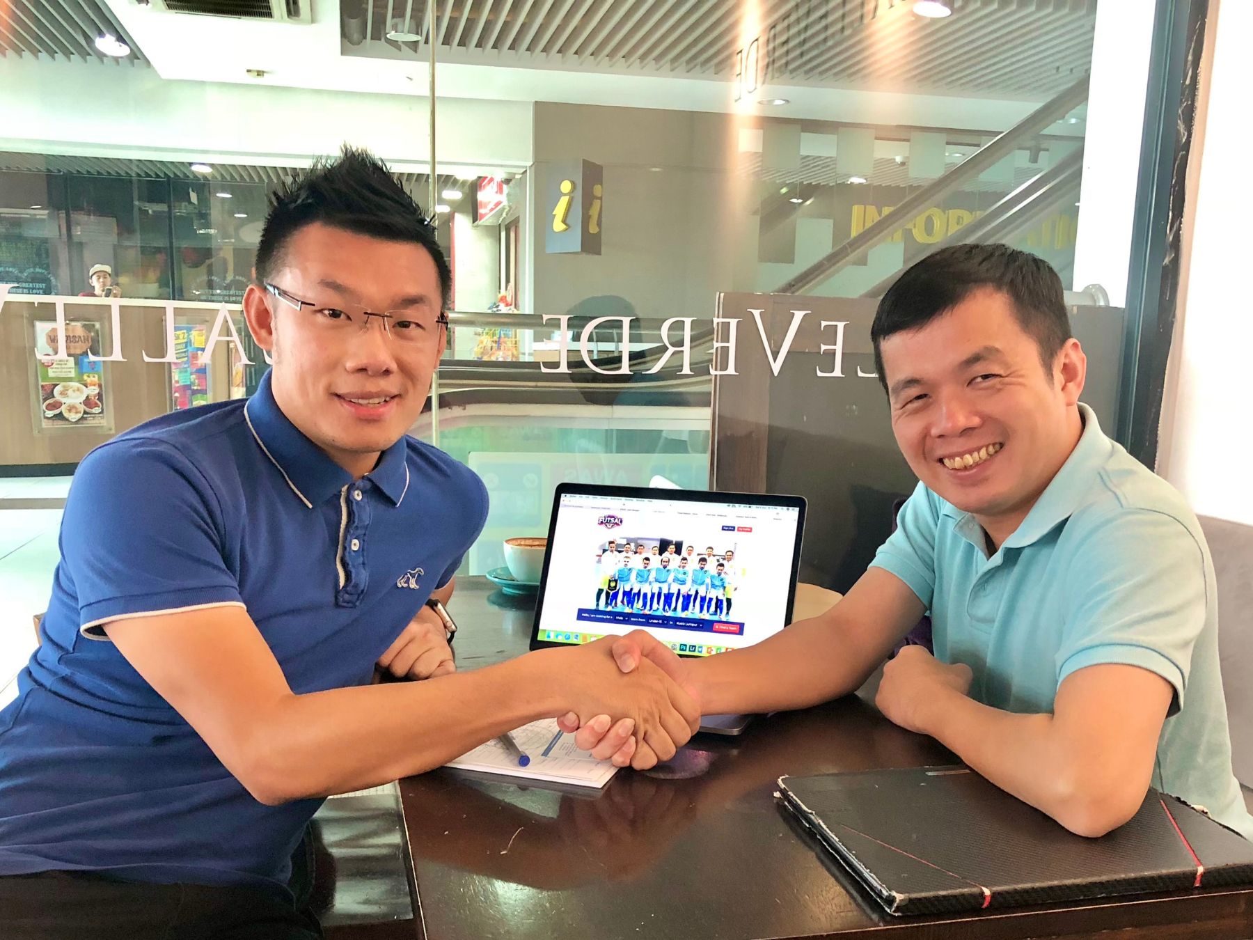 Samuel Siew marking an early Futsal Malaysia partnership over a working conversation